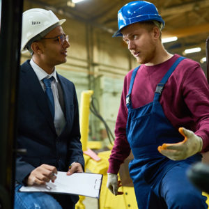 Businessman talking in warehouse