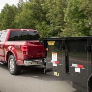 Hot shot truck hauling trailer
