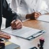 Business owner filling out LLC/ S Corp/C Corp paperwork